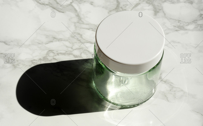 Empty glass jar on marble countertop