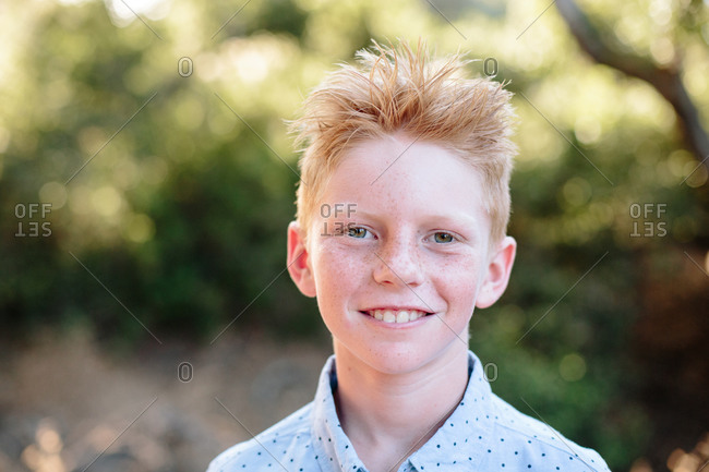 blond boy with freckles stock photos - OFFSET