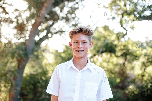 Outside Portrait Of A Handsome Teenage Boy With Braces