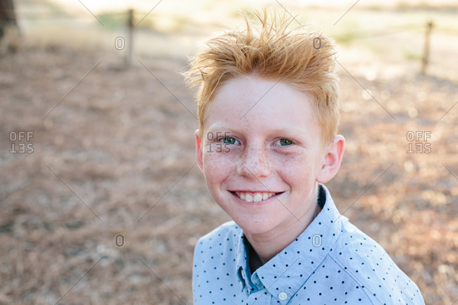 blond boy with freckles stock photos - OFFSET