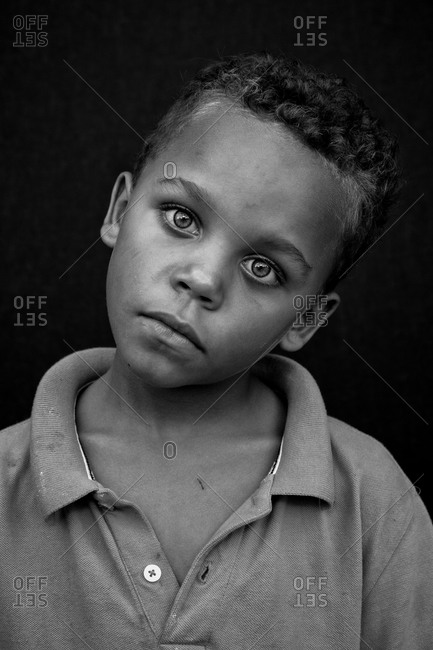 Delhi, INDIA - may 2020 : Portrait of a young Indian poor boy in polo