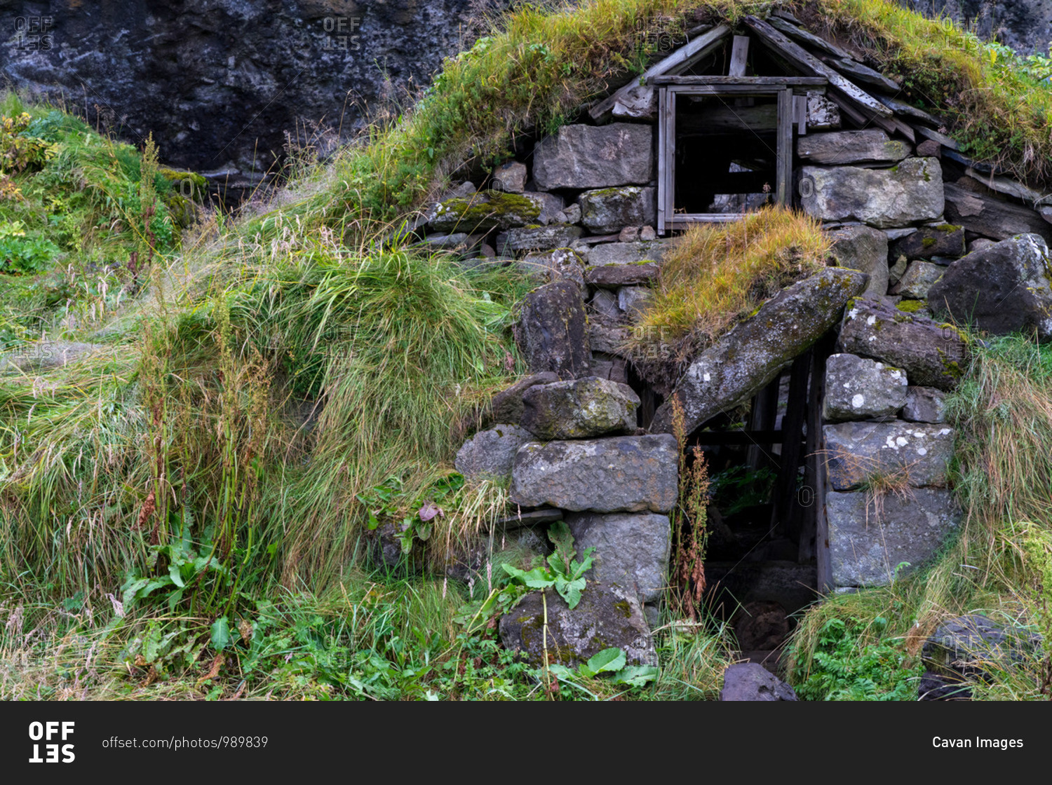 Old hut ruins built form rocks in Iceland with grass covered roof