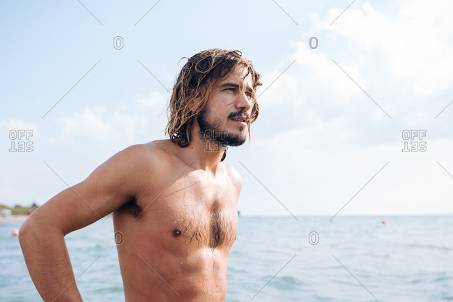 Man at seaside after a swim