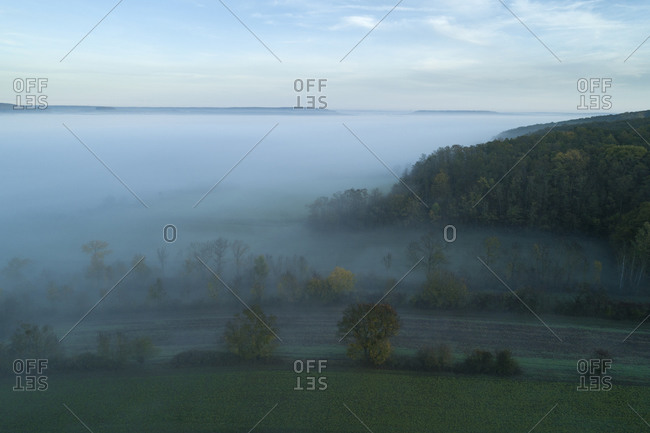 Germany- Bavaria- Drone view of Franconian Heights shrouded in thick morning fog