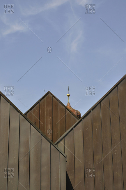 Germany- Baden-Wurttemberg- Sigmaringen- Church belfry peeking over wooden houses