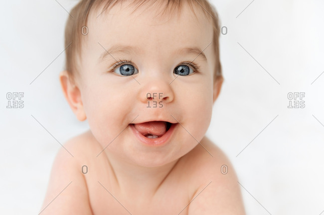 Close up of smiling baby face looking at camera