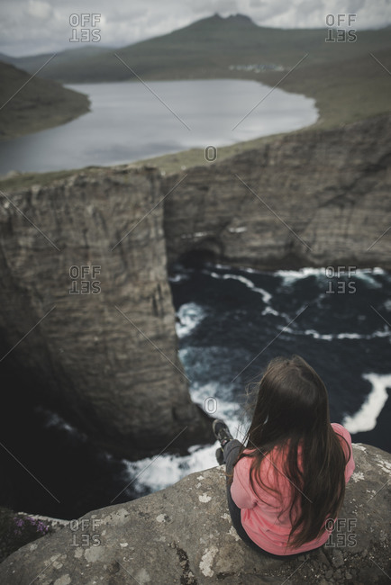 Denmark, Faroe Islands, Sorvagsvatn lake, Woman looking at dramatic landscape