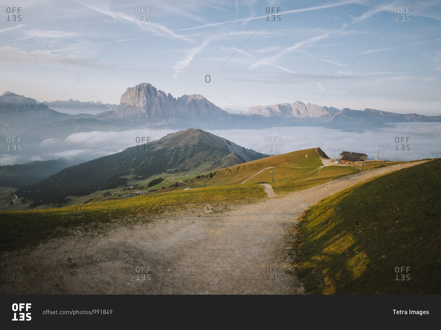 Italy, Dolomite Alps, Scenic view of small village in Dolomites at sunrise