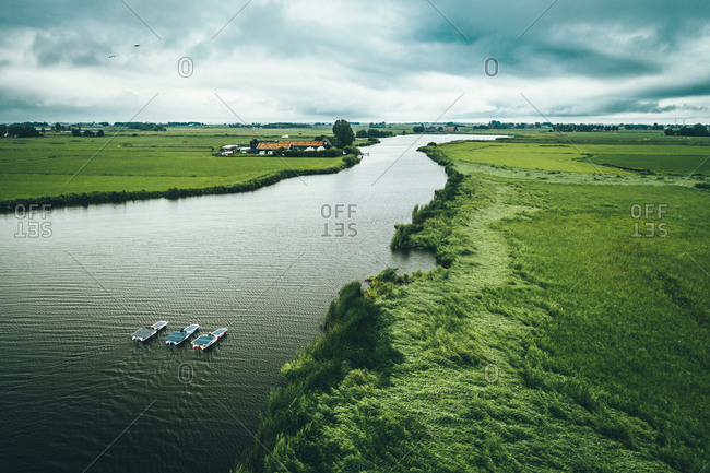 Aerial view of solar panel boats navigating through the farmlands in Nijhuizum, Friesland, The Netherlands.