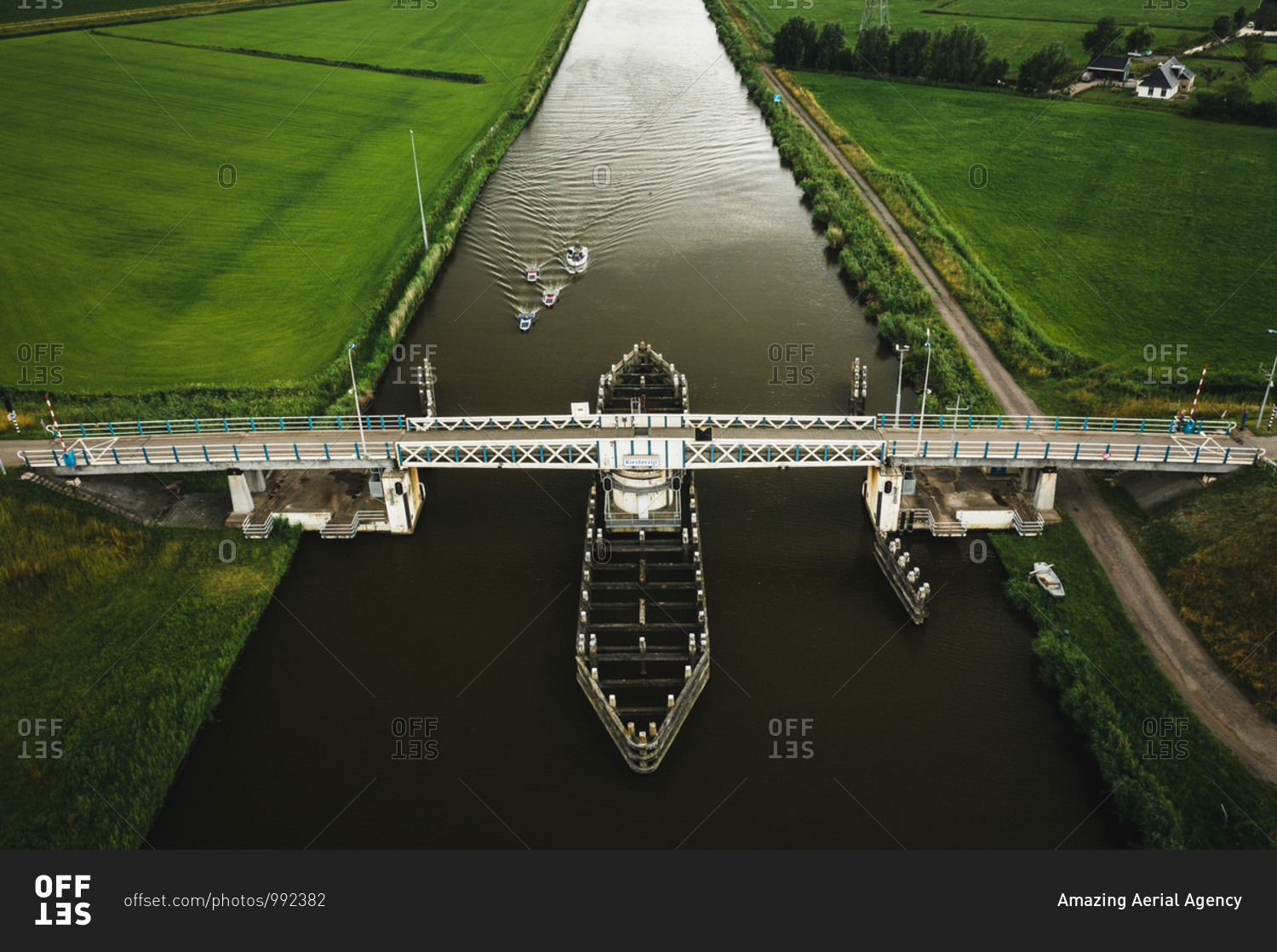 Aerial view of solar panel boats navigating through the farmlands of Harlingen, Friesland, The Netherlands.