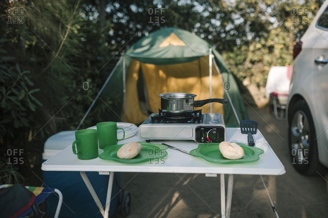 Breakfast prepared in portable kitchen on a camping trip
