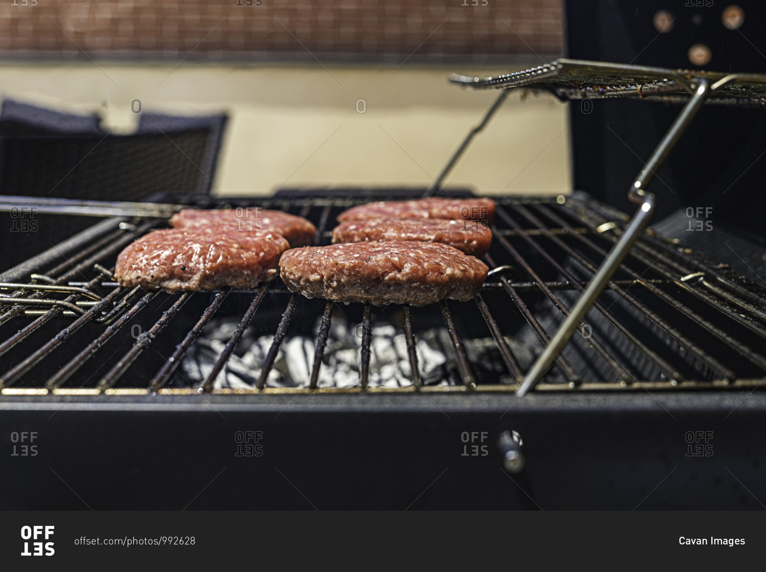 Hamburgers on the barbecue. Close-up view.