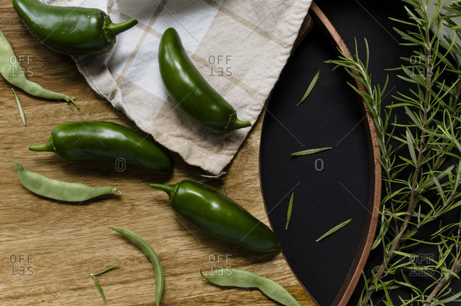 Jalapenos and Rosemary on a Cutting Board Flatlay