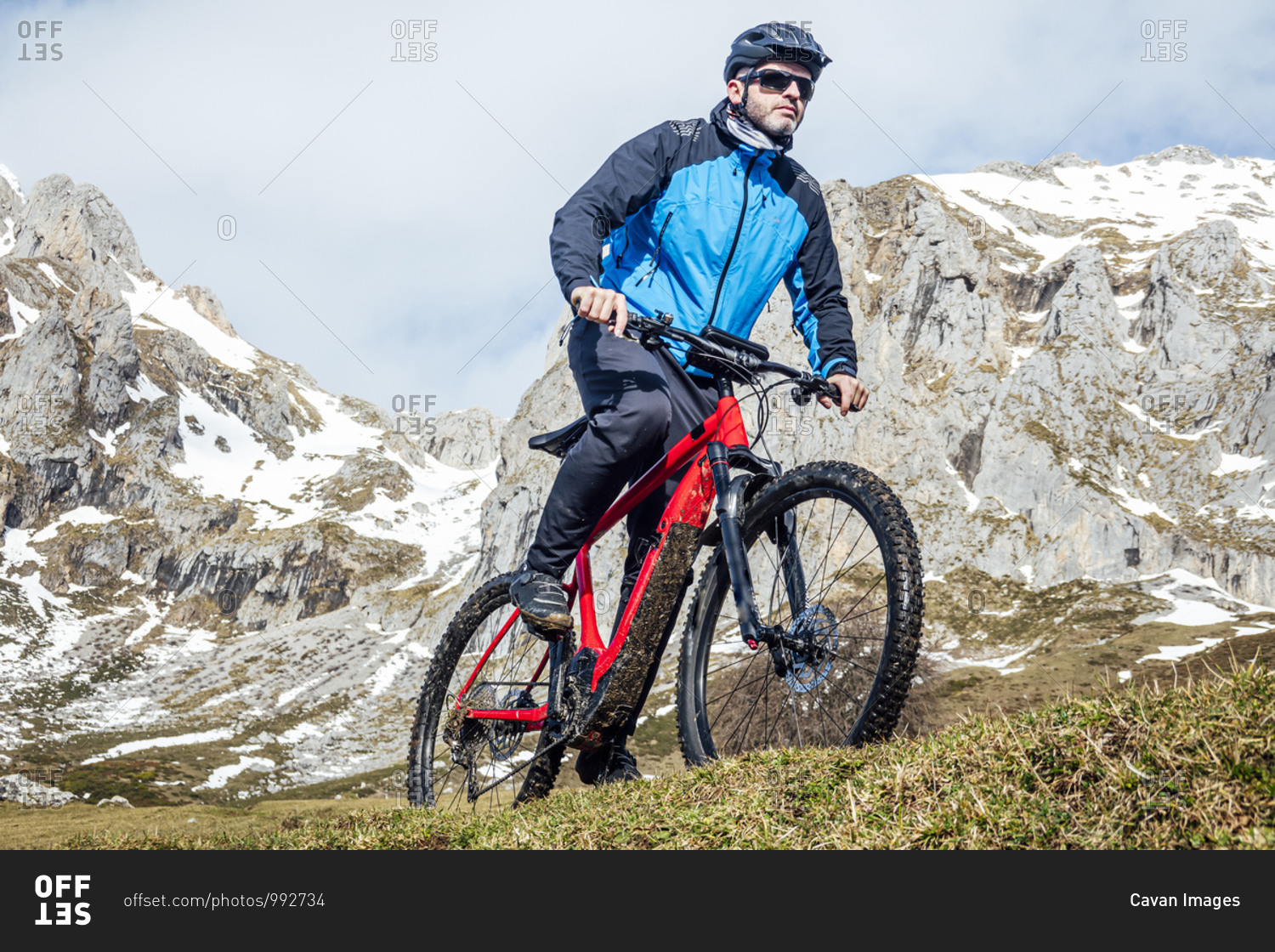 Cyclist man riding mountain bike stock photo -\
OFFSET