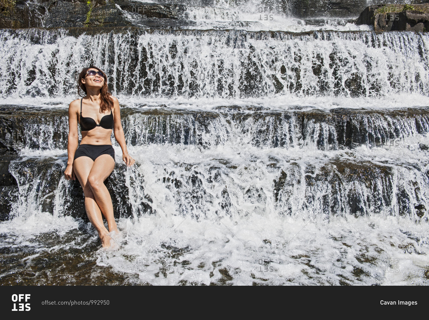 Beautiful woman at the Pongour waterfall close to Da Lat in Vietnam