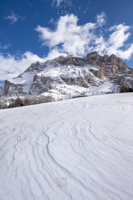 Hochabtei / Alta Badia, Bolzano province, South Tyrol, Italy, Europe. Winter on the Armentara meadows. In the background the peaks of the Zehnerspitze and the Heiligkreuzkofel