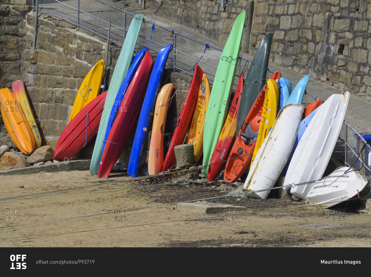 May 28, 2018: Colorful surfboards in the harbor, Mousehole,\
Penzance, Cornwall, South West England, England, United Kingdom,\
Europe stock photo - OFFSET