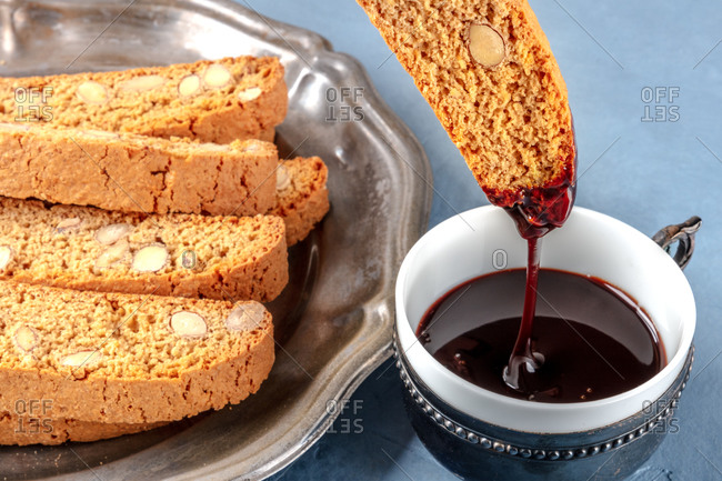 Biscotti, traditional Italian almond biscuits, dipped in a cup of hot chocolate