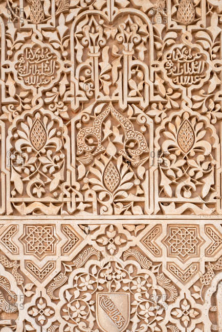 Granada, Spain - January 0, 1900: Ancient arabic ornaments on the wall of Alhambra, Granada, Spain
