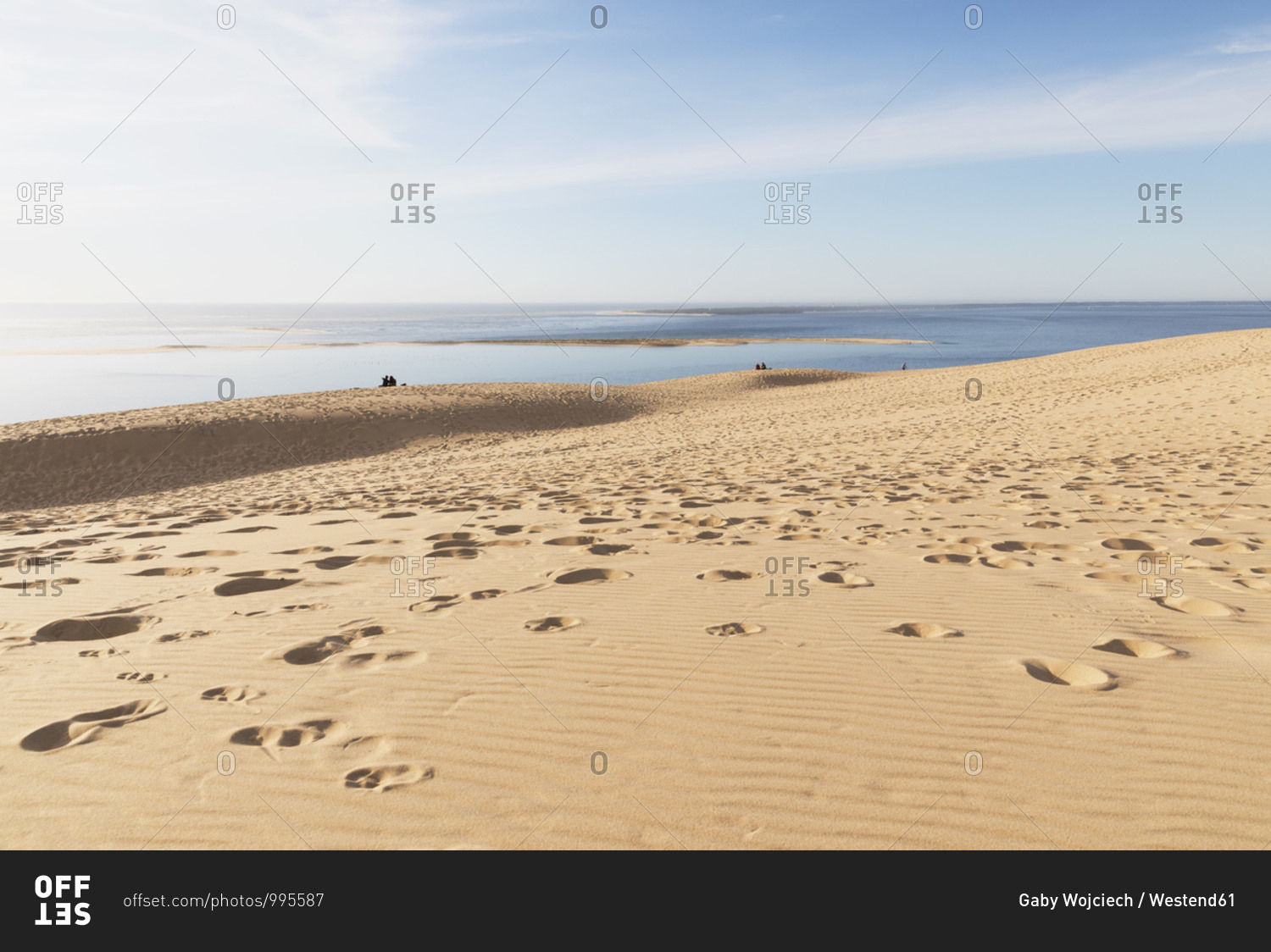 Scenic view of Pilat dunes and Atlantic ocean against sky during sunny day- Nouvelle-Aquitaine- France