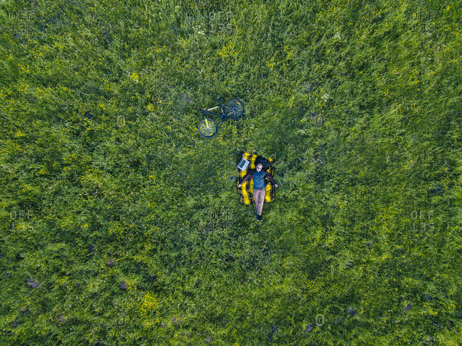 Man lying on grass- aerial view