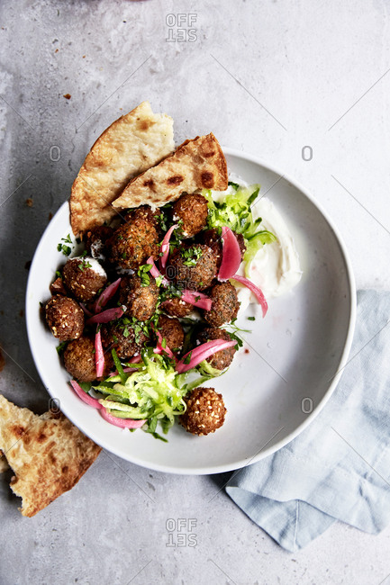Falafels with pickled red onions, yoghurt and cucumber and naan