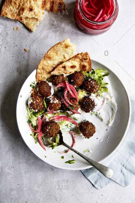 Falafels with pickled red onions, yoghurt and cucumber and naan