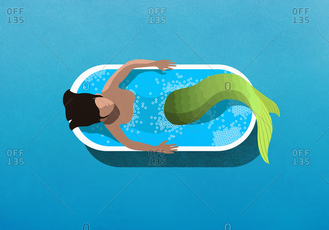 Mermaid bathing in soaking tub