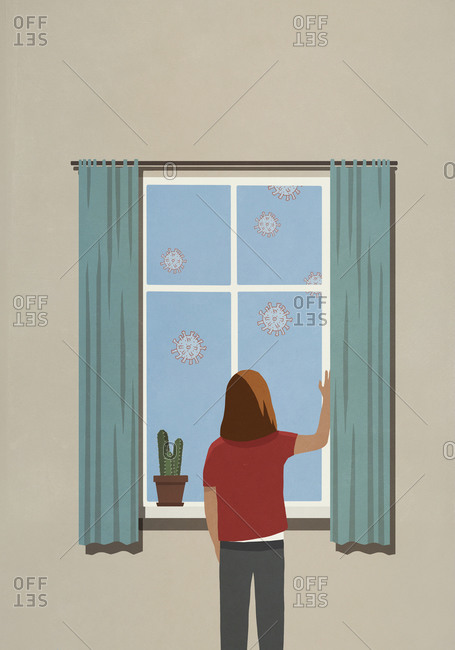 Woman at window watching floating coronavirus particles