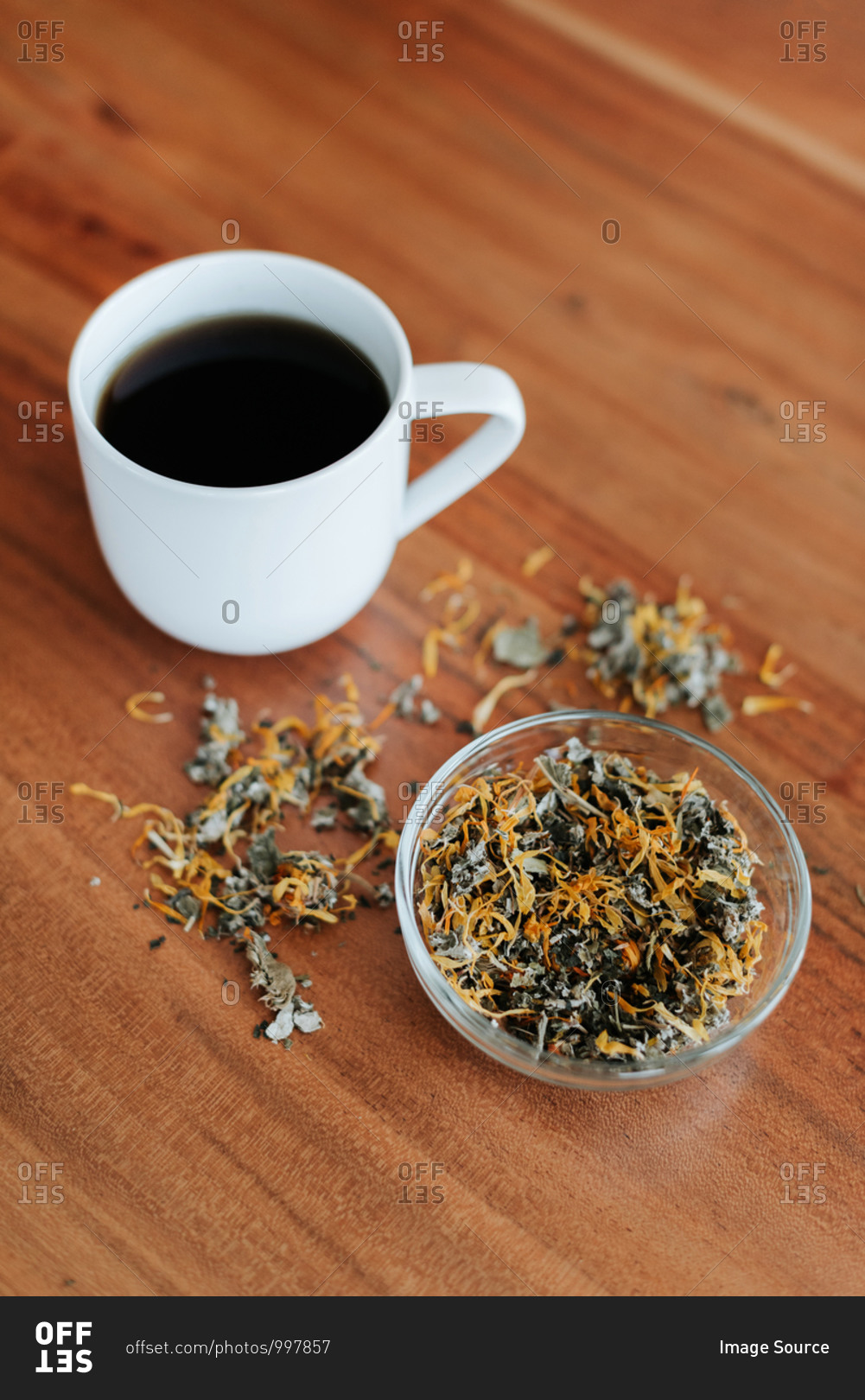 Mug of herbal tea and tea leaves