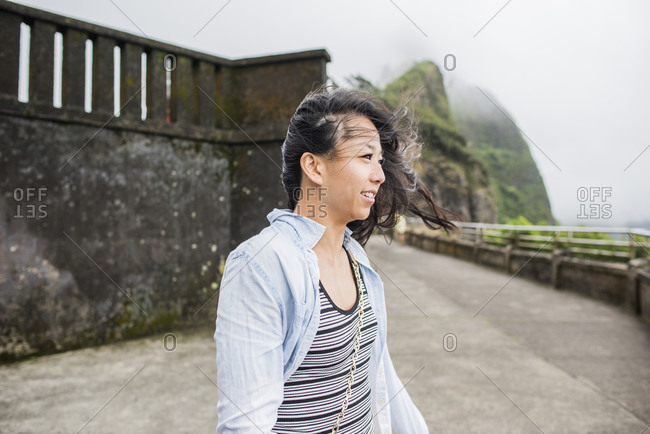 Woman with windswept hair, Niuean Pali Lookout, Oahu, Hawaii