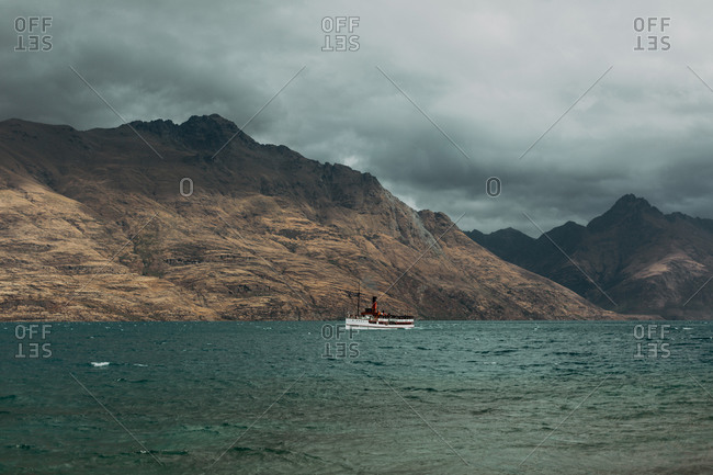 Scenic view, vessel sailing past mountains, Queenstown, Canterbury, New Zealand