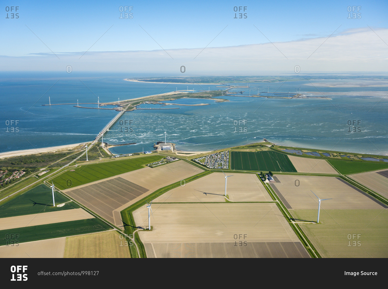 The famous Oosterscheldekering flood barrier and fields with wind turbines in the background, aerial view, Vrouwenpolder, Zeeland, Netherlands