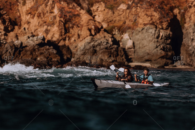 Friends kayaking in sea, Big Sur, California, United States
