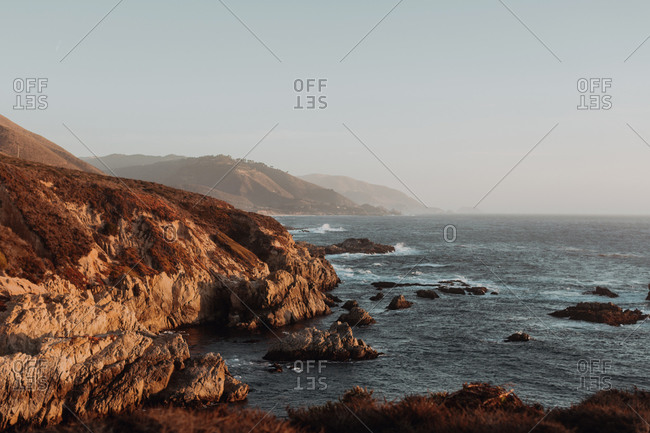 Scenic view of cliffs and misty coastline, Big Sur, California, United States