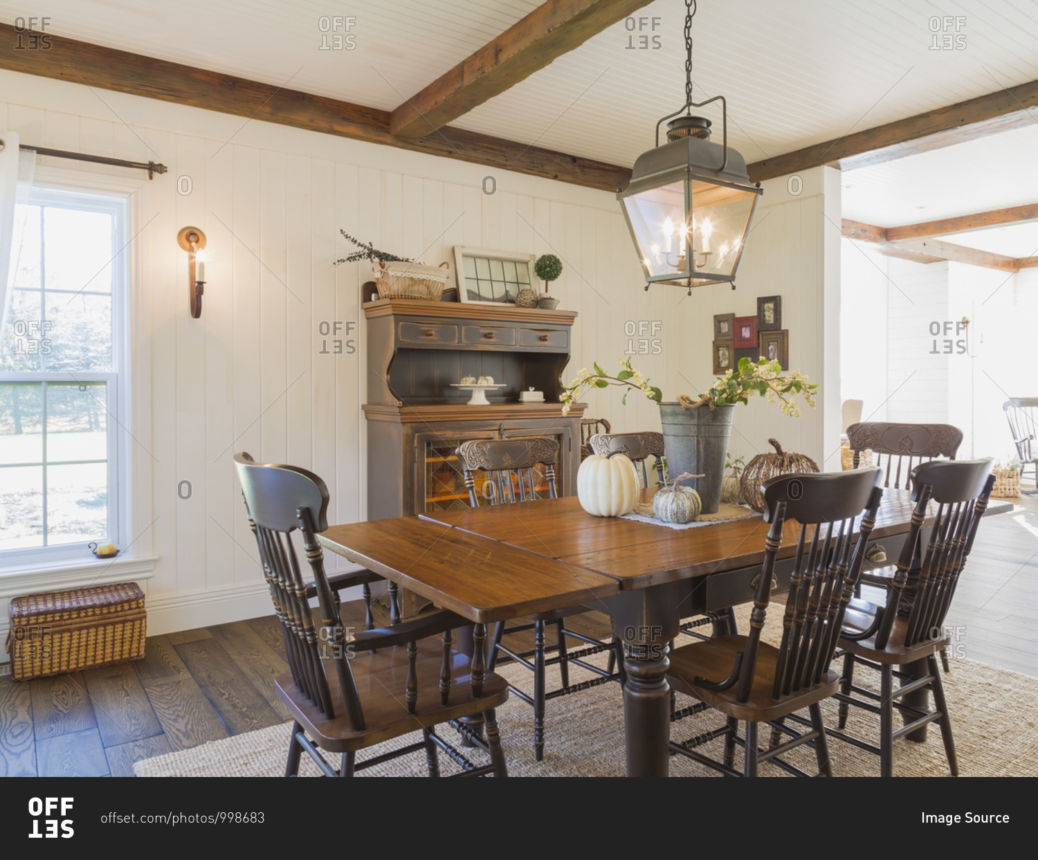Interior view of dining room with brown stained pine wood antique