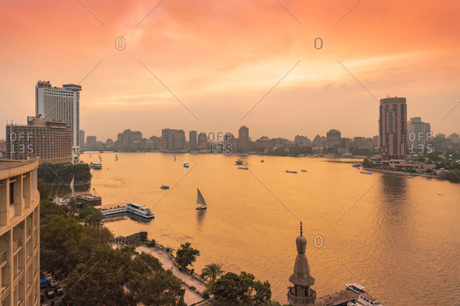 Egypt- Cairo- Nile with skyline and downtown area from Garden City at sunset