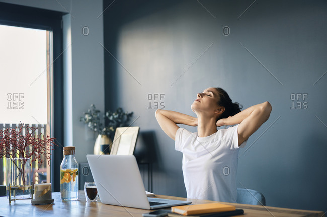 woman sitting at an office desk and working with a computer