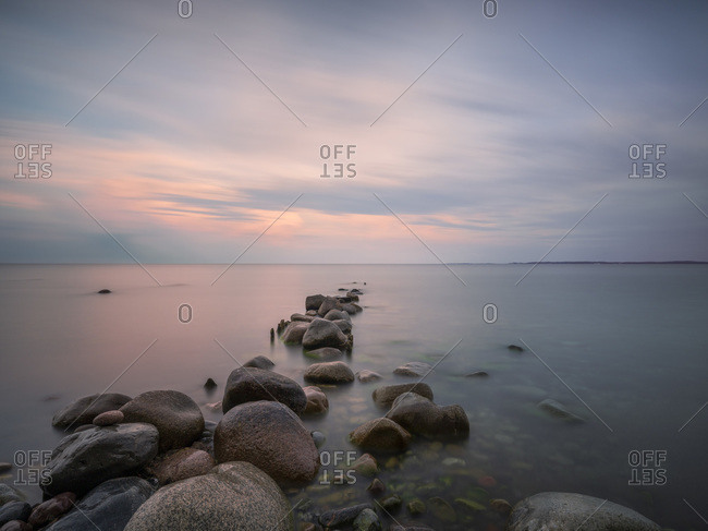 Germany- Mecklenburg-Western Pomerania- Rocky shore of Rugen island at dusk