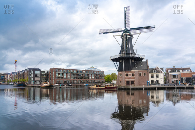 Netherlands- North Holland- Haarlem- Spaarne river canal and De Adriaan windmill