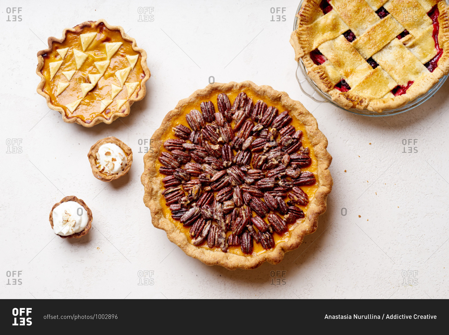 Variety of thanksgiving pies with berries, pumpkin and pecan