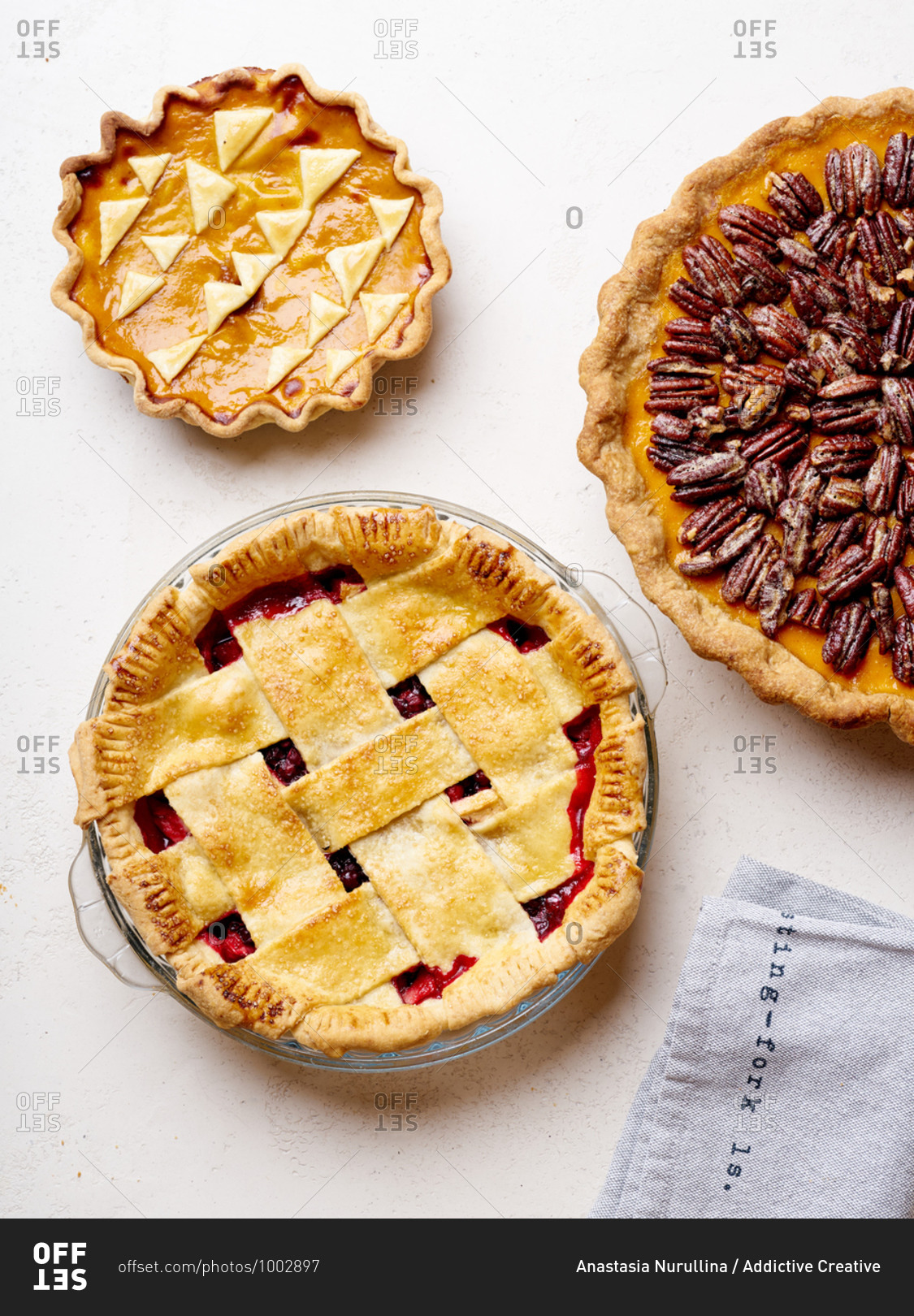 Variety of thanksgiving pies with berries, pumpkin and pecan