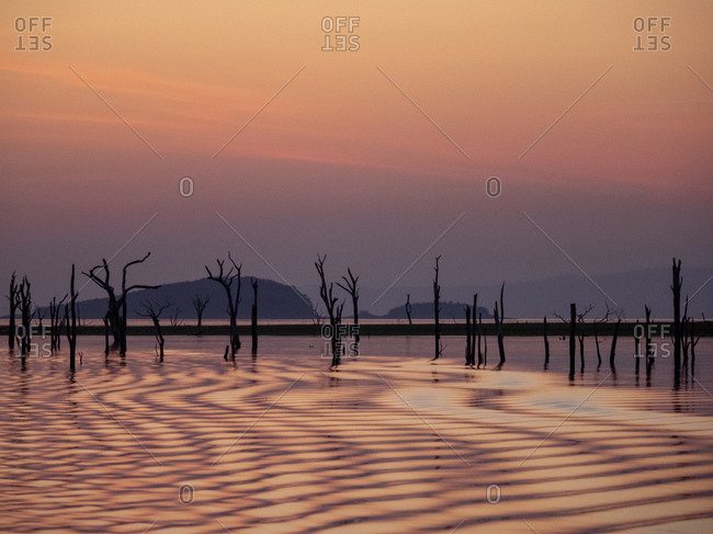 Sunset over Lake Kariba, the world's largest man-made lake and reservoir by volume, Zimbabwe, Africa