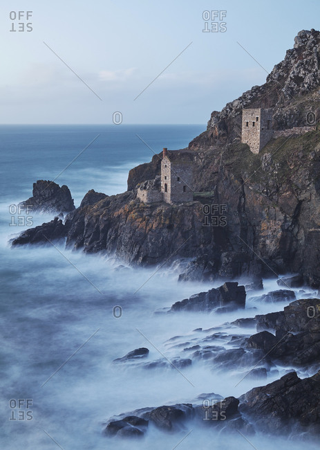 A dusk view of the iconic cliffside ruins of Botallack tin mine, UNESCO World Heritage Site, near St. Just, near Penzance, in west Cornwall, England, United Kingdom, Europe