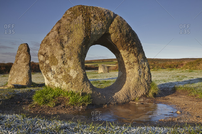 The mysterious prehistoric Men-an-Tol ring stone on a frosty morning, in a field near Penzance, in west Cornwall, England, United Kingdom, Europe