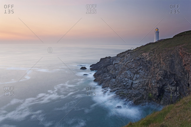 A peaceful dusk on Cornwall's Atlantic coast, showing the lighthouse at Trevose Head, near Padstow, Cornwall, England, United Kingdom, Europe