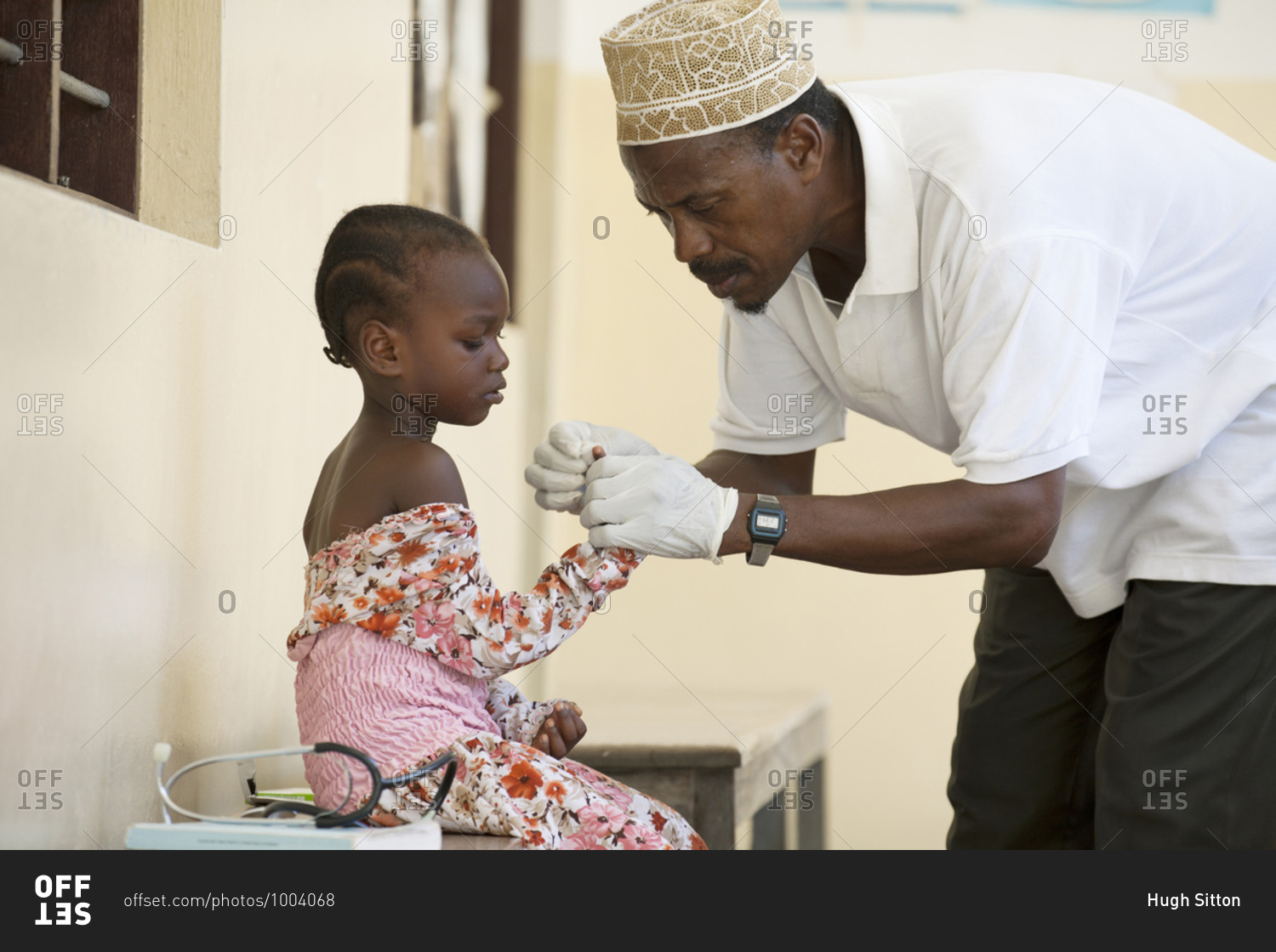 Doctor treating a young girl at a medical clinic in Africa