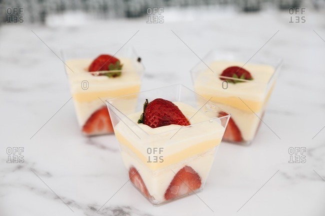 Strawberry pudding parfaits on marble surface