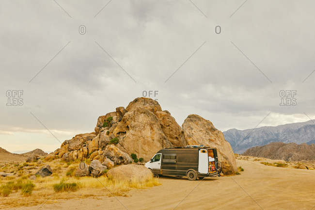 Camper Van parked near boulders in northern California.