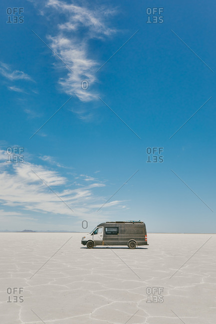Camper van on Bonneville Salt Flats in Utah during a summer road trip.